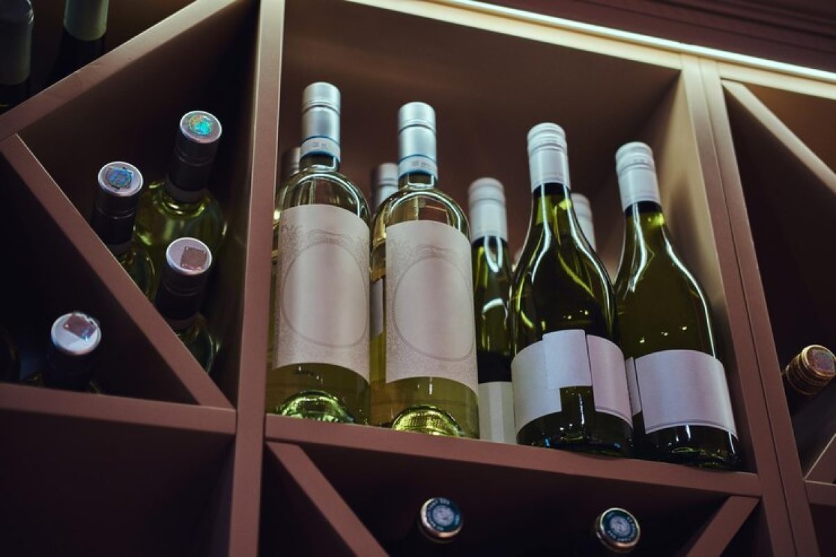 bottles-tasty-wine-posh-reastoraunt-are-stored-shelf_613910-17445