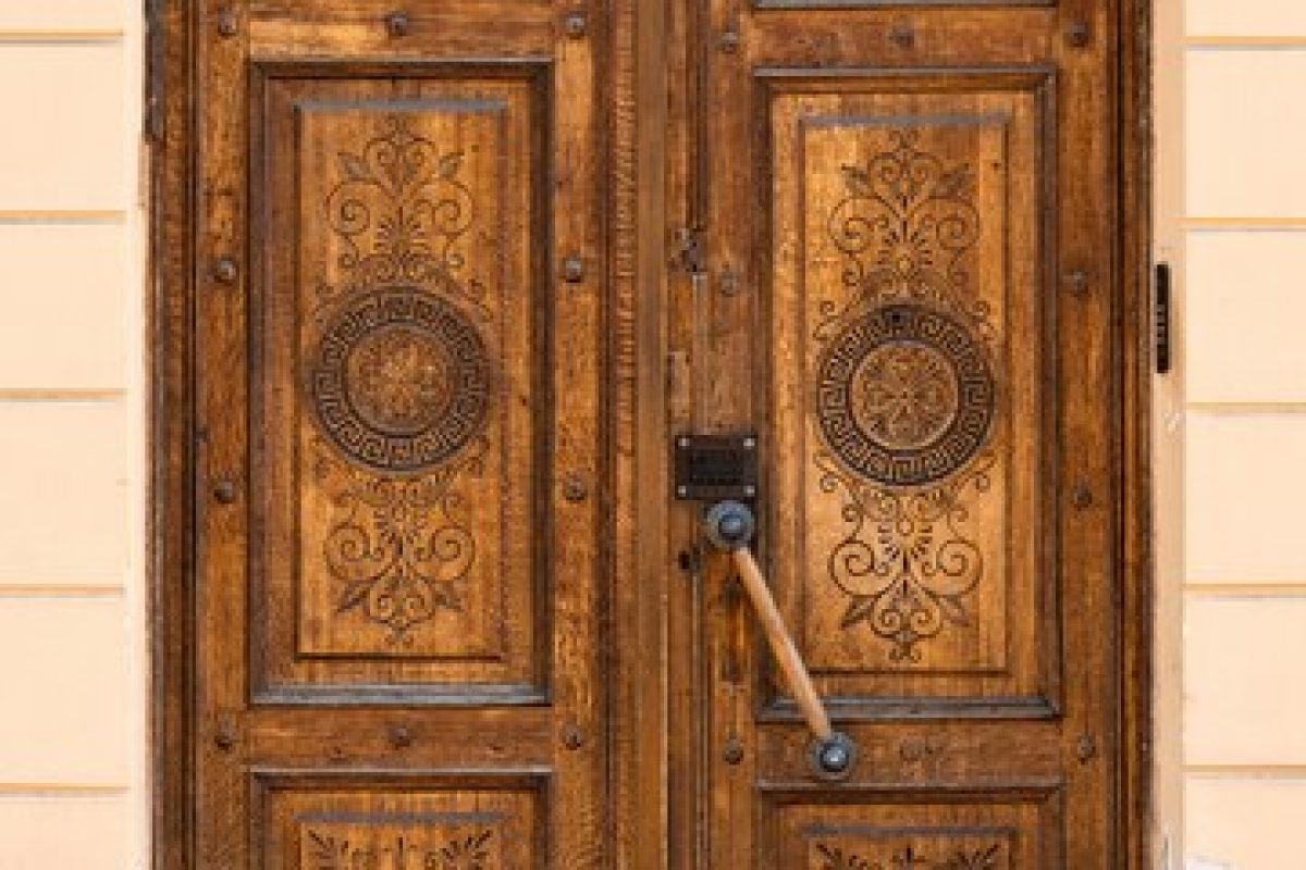 brown-vintage-wooden-door-with-elegant-carving_270941-37